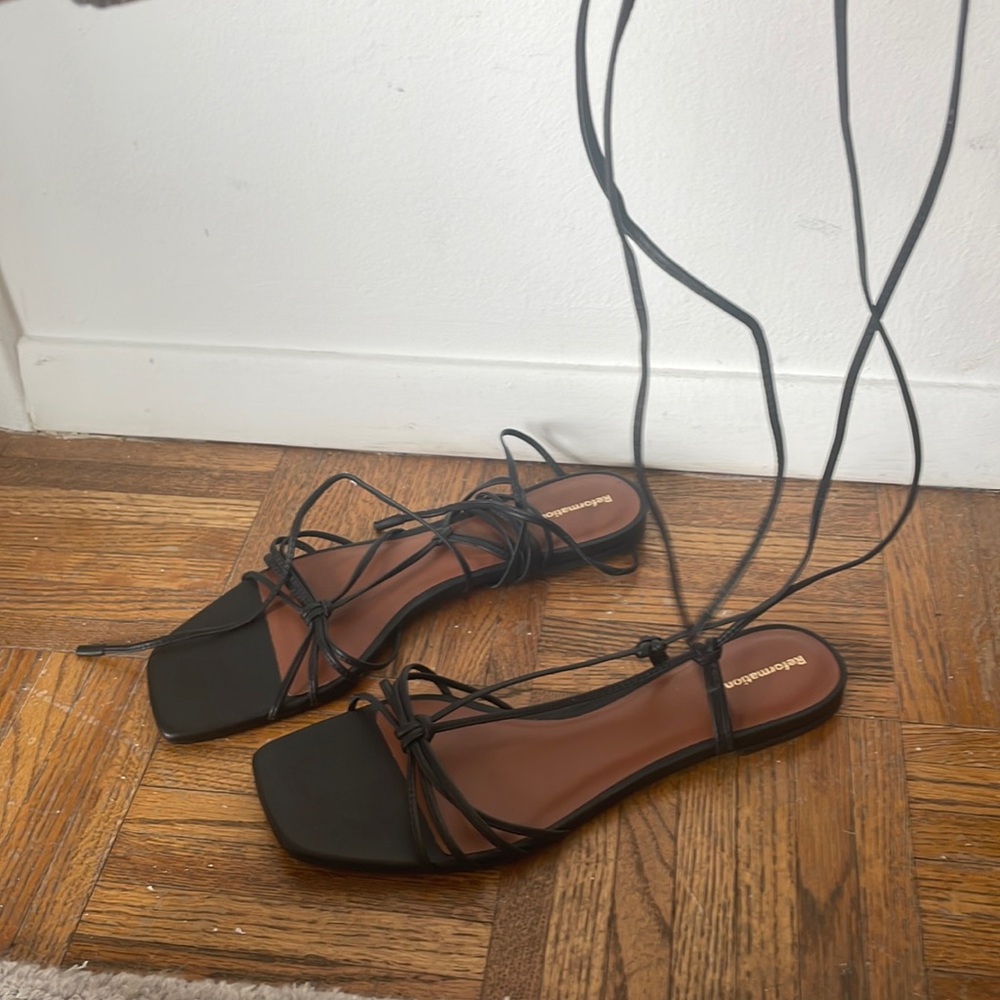 Never been worn Reformation black gladiato sandal W’s sz.9.5
